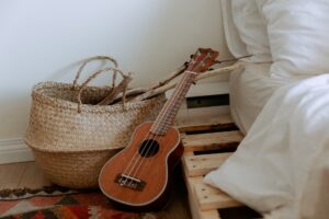 guitar beside bag and bed 300x200 - guitar beside bag and bed