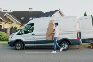 man carrying boxes 300x200 - man carrying boxes
