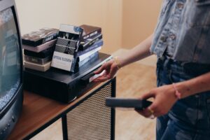 person holding a vhs tape 300x200 - person holding a vhs tape