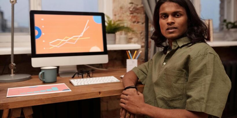 man sitting in front of his computer 820x410 - Choosing an SEO Agency: 8 Insider Tips You Need to Know