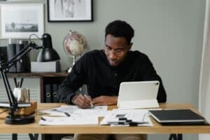 man doing paperwork 300x200 - man doing paperwork