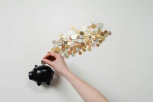 person putting coin in a piggy bank 1 300x200 - person putting coin in a piggy bank_1.jpg