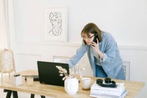 woman talking on the phone and looking at a laptop 300x200 - woman talking on the phone and looking at a laptop.jpg