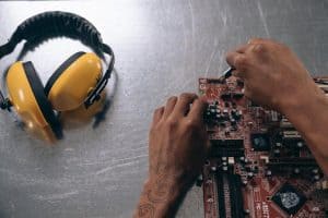 a person holding a motherboard 300x200 - a person holding a motherboard.jpg