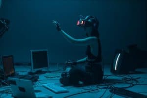 woman immersed in virtual reality  surrounded by tech  in a dimly lit room 300x200 - woman immersed in virtual reality_ surrounded by tech_ in a dimly lit room..jpg