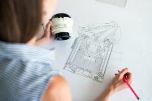 female engineer studying a detailed technical blueprint at her workspace. concept of design and innovation 300x200 - female engineer studying a detailed technical blueprint at her workspace. concept of design and innovation..jpg