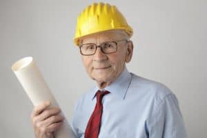 senior engineer in safety gear holding blueprints  symbolizing experience and dedication in civil engineering 300x200 - senior engineer in safety gear holding blueprints_ symbolizing experience and dedication in civil engineering..jpg