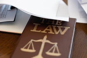 A Law Book on a Wooden Desk Beside Papers 300x201 - A Law Book on a Wooden Desk Beside Papers