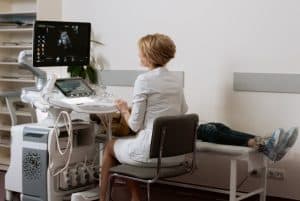 a doctor doing an ultrasound 300x201 - a doctor doing an ultrasound