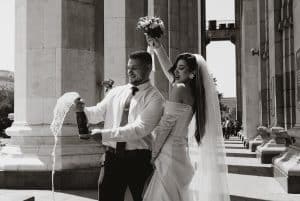 newlywed couple opening a bottle of champagne 300x201 - newlywed couple opening a bottle of champagne