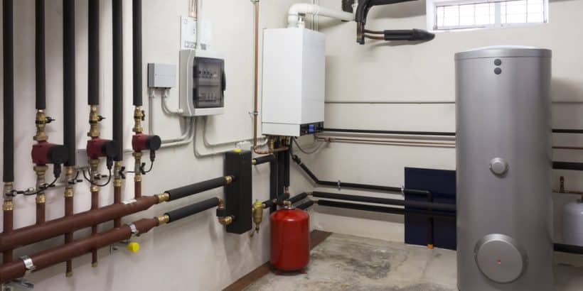 tank water heater in an empty room 820x410 - Understanding Water Heater Size: What You Need to Know