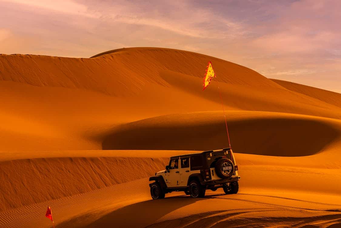 a jeep on desert - Can You Use Any Flag for Offroading? Find Out Why