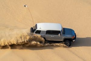 a truck in sand dune 300x201 - a truck in sand dune