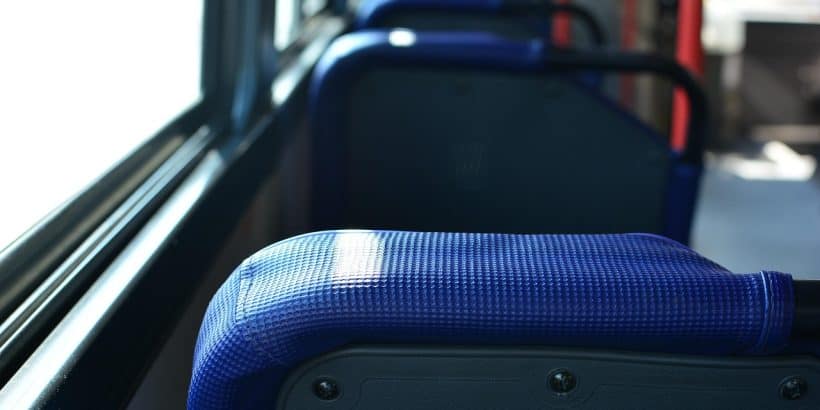 blue chairs of a bus 820x410 - How to Reduce Commuting Stress Using Shuttle Buses