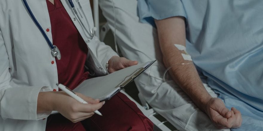 Doctor Beside a Patient 880x440 - 5 Reasons Attorneys Rely on Professional Imaging Centers